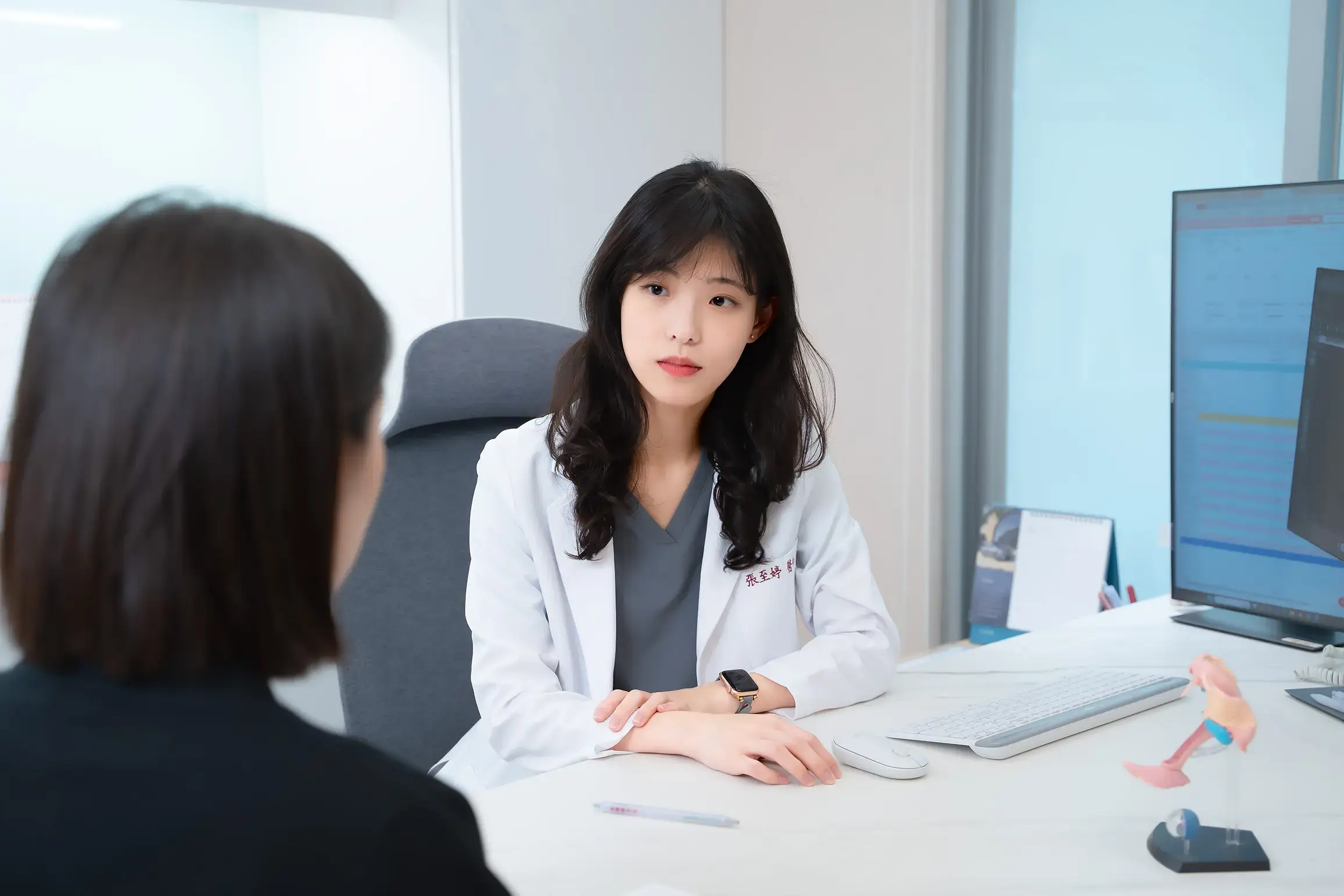 Female doctor consulting patient about social egg freezing in fertility clinic
